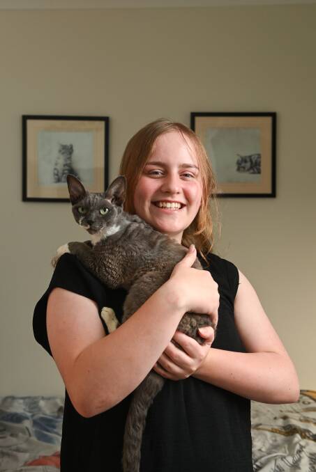 ROAD TO RECOVERY: Ella McMahon, 14, has recovered in the company of her beloved Devon Rex cat, Sky. 