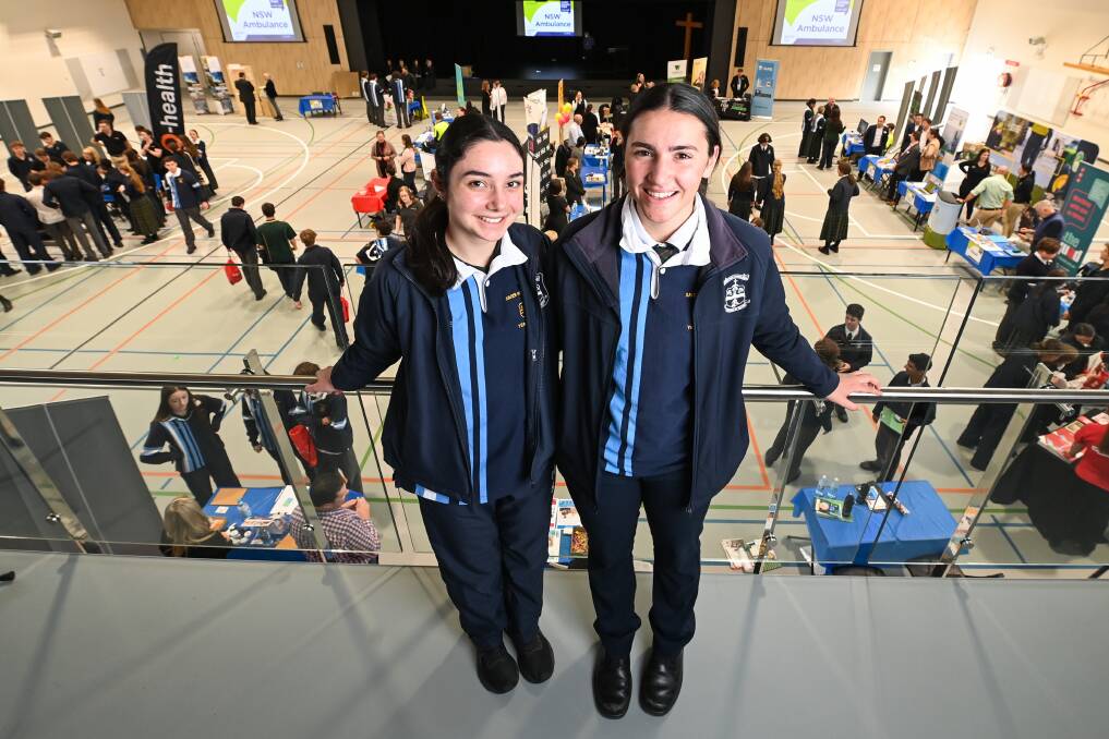 NEW HEIGHTS: Xavier High School school captain Angelina Barker, 18, and fellow Year 12 student Amelia Quinn, 17, both received offers to study at Charles Sturt University. 