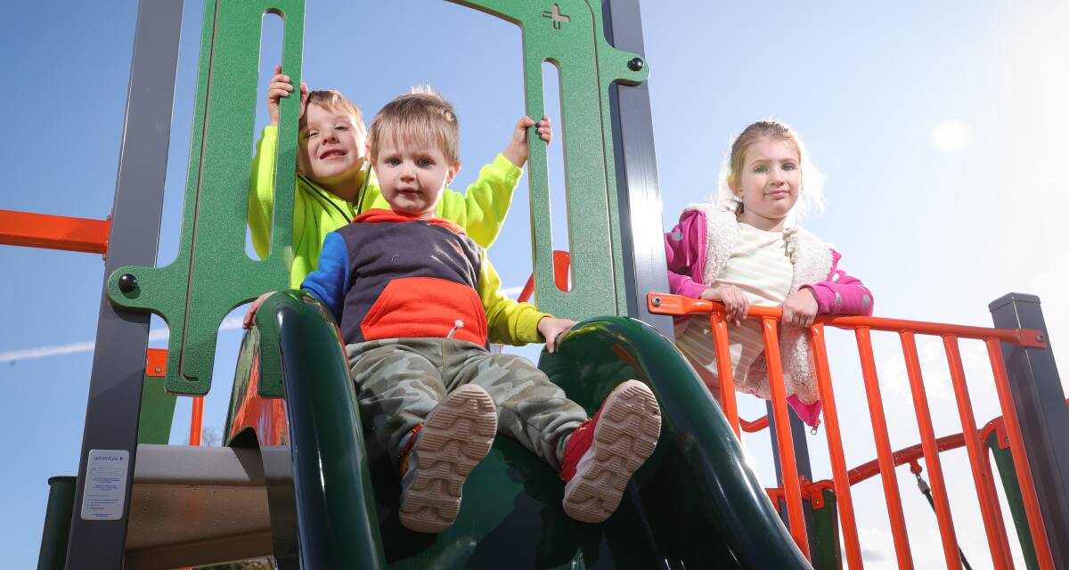 MORE FUN: Wodonga Council has upgraded the children's playground at Bill Black Park, which has been enjoyed by children like Ralph Fletcher, 2, James Rollings, 4, and Sammy Fletcher, 5. Picture: JAMES WILTSHIRE