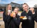 HEALTHY START: North Albury's Xavier High School students Zoe Prentice, 16, May Summerfield, 17, and Karly Thomas, 16, dig into their healthy lunches from the school canteen. Picture: JAMES WILTSHIRE