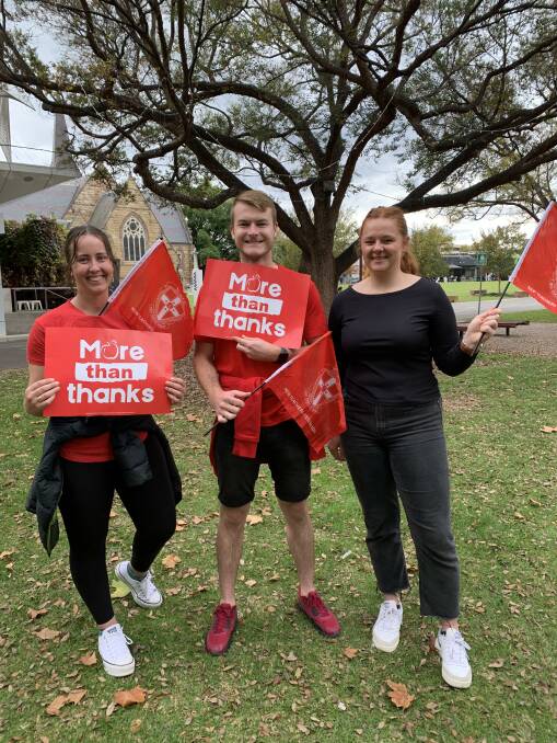 JUGGLE: Sarah Firkin, Jeremy Scott and Grace Oswald at the teachers strike. Their workload had increased as a result of the staffing shortage. 