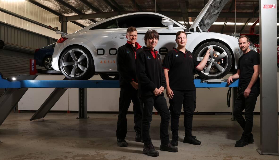 CUTTING EDGE: Automotive technologies company, Doftek, regularly tests vehicles at Wodonga TAFE. Motor sports teacher Troy Gay, with first-year students Caity Wilks and Shaun Flanagan, and Doftek's Geoff Rogers check out a test vehicle. Picture: JAMES WILTSHIRE