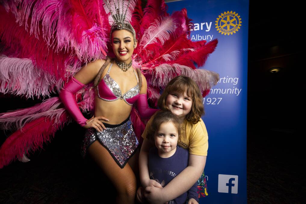 BRIGHT LIGHTS: Performer Elysha Atwell met Eloise Perston, 3, and Alexis Perston, 7, as they enjoyed the show yesterday at Commercial Club Albury. Picture: ASH SMITH