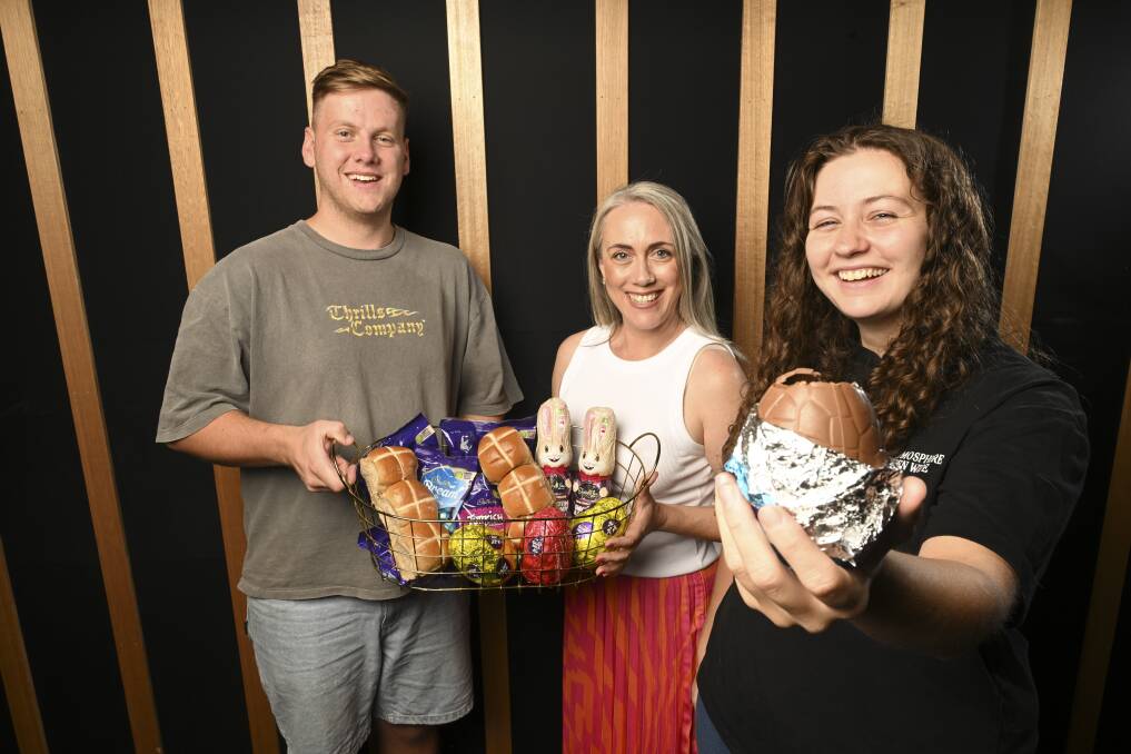 New Life Chapel's Matthew Barton, Natt Cross and Darlene Knights look forward to the morning of fun, laughter and plenty of eggs. Picture by Mark Jesser.
