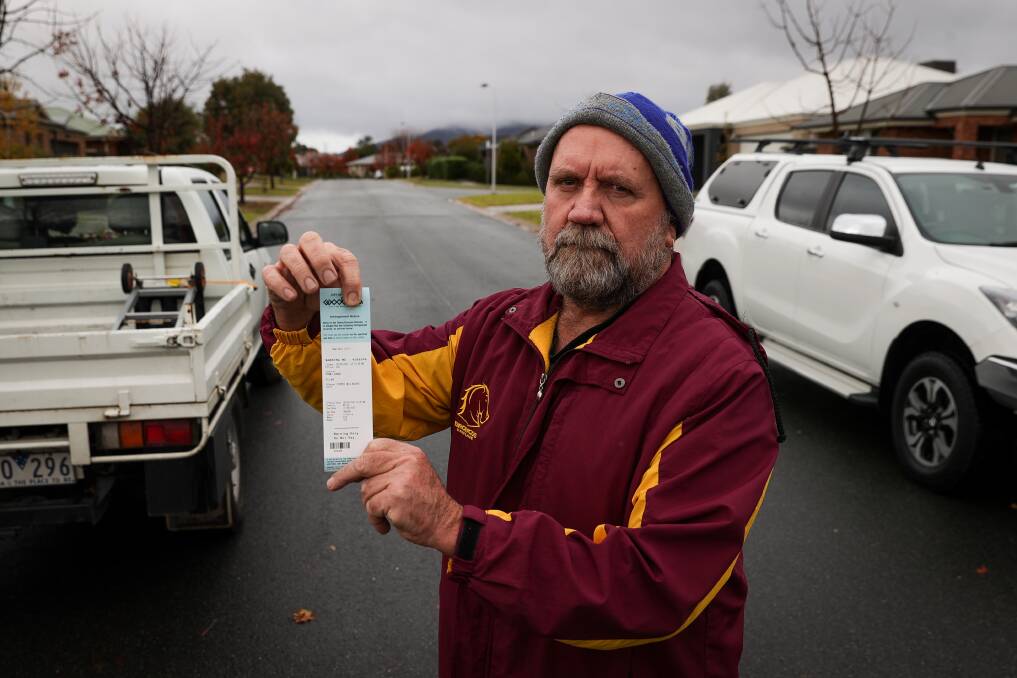 "We try to do the right thing by giving people extra room when driving on the road," says resident Vin Ford, pictured on Rooney Avenue with one of his infringement notices. Picture: JAMES WILTSHIRE.
