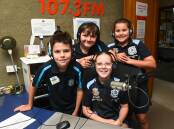Year 5 students Jax Murray, 10, Alexander Sergi, 11, Zoe Stevens, 11, and Poppy Colvin, 11, are so excited to be heard near and far on the airwaves. Picture by Mark Jesser.
