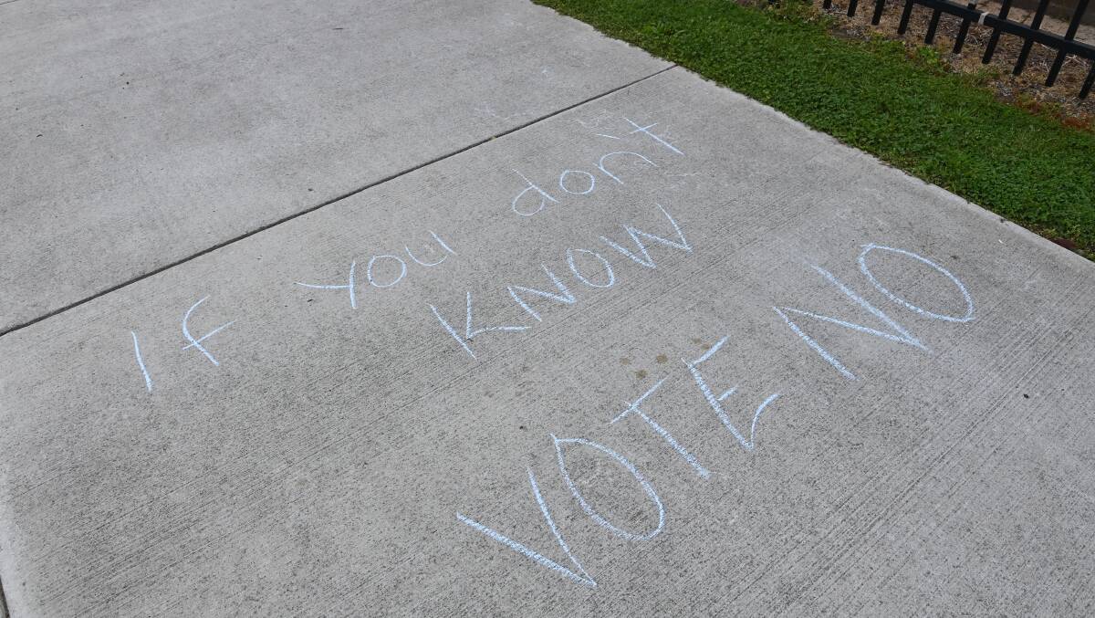 Messages such as "if you don't know, vote no" were drawn on footpaths at voting booths in Albury. Picture by Mark Jesser