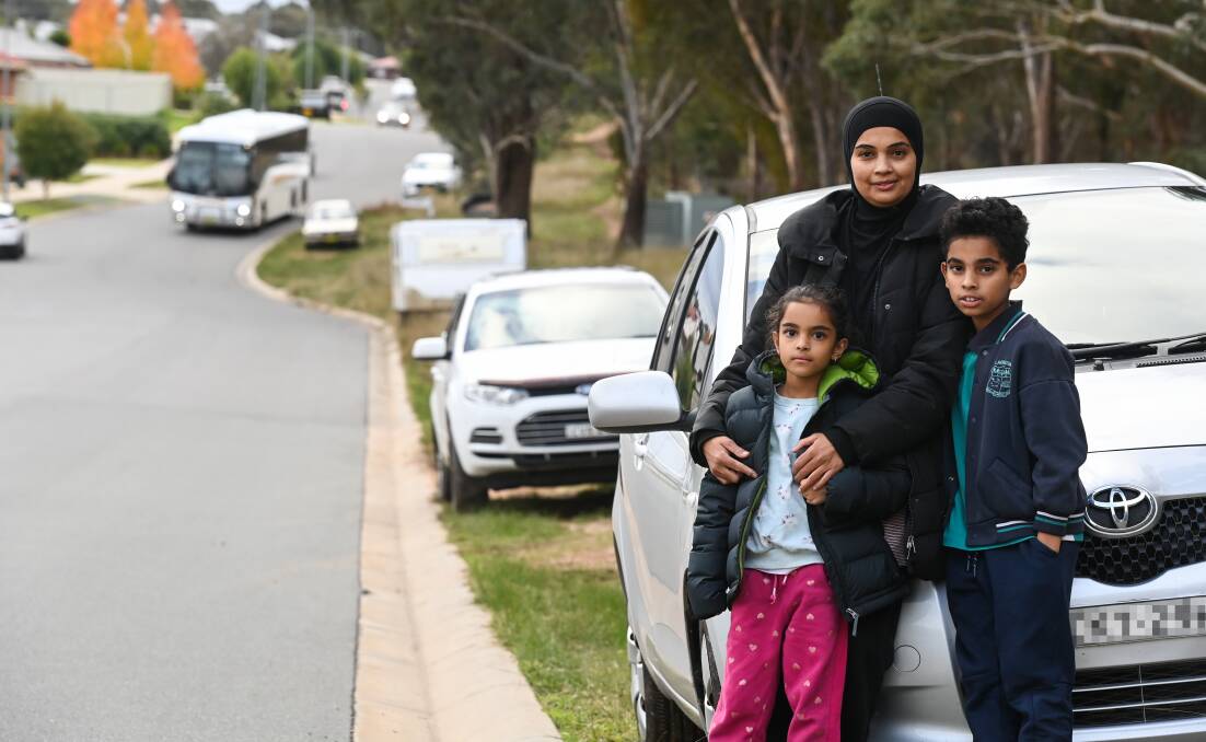  Shahin Mohammed with her kids Sarah, 7 and Shabaan, 9, park on the kerb like everyone else on the street and don't see the problem. Picture: MARK JESSER