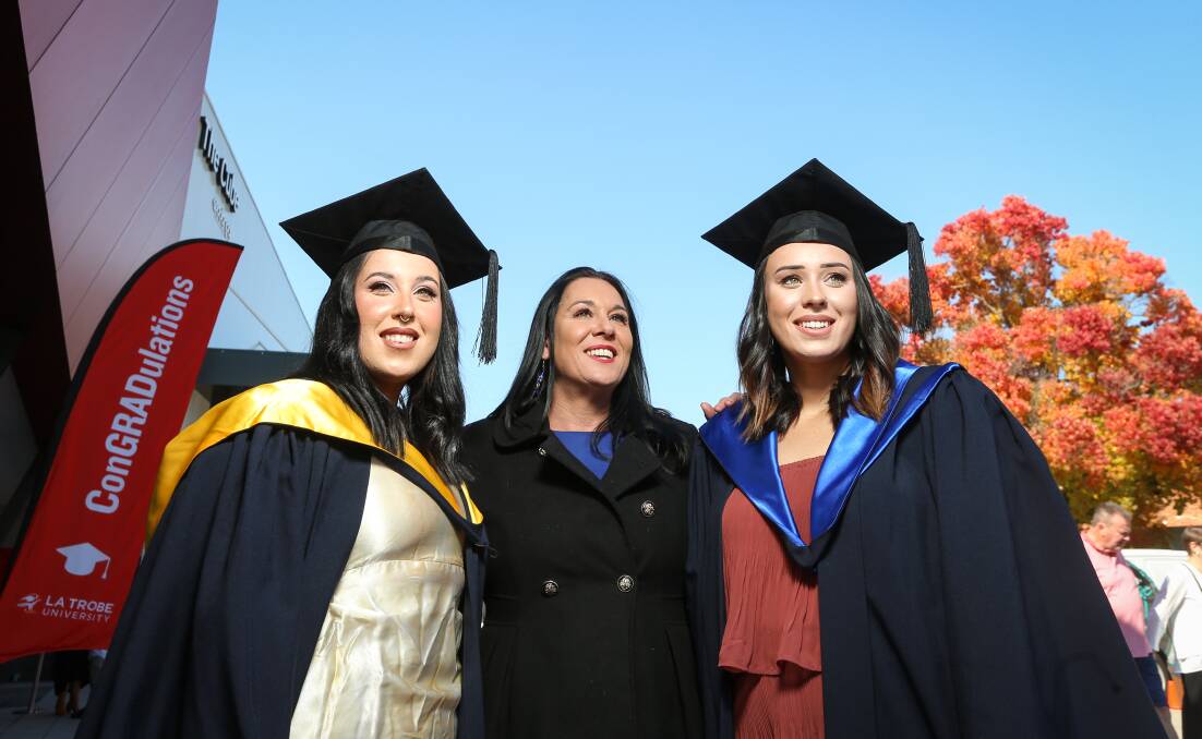 UNIVERSITY SUCCESS: La Trobe graduates, Willow and Summer Benson with mother, Natasha Benson. 