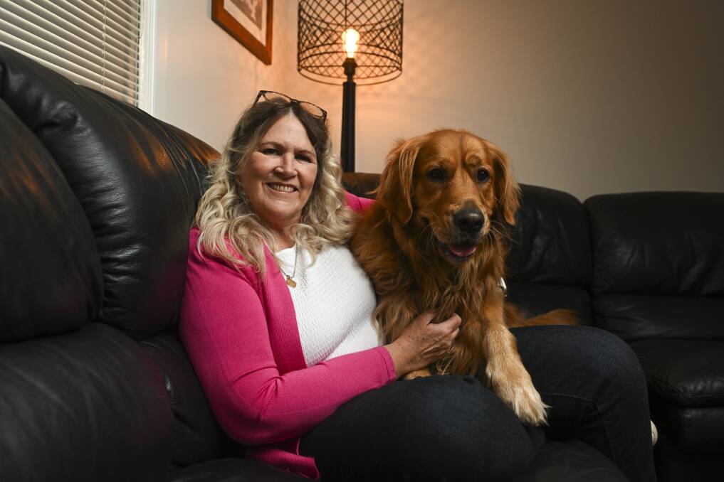 Albury's Janine McKay with her dog Bella, who has been her support dog while she now works full-time at home. "Bella reminds me that I need to have breaks and slow down," she says. Picture by Mark Jesser. 