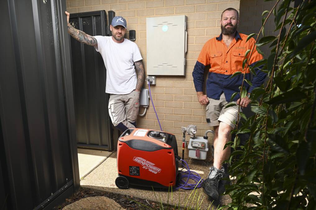 Luke Sutherland with electrician Peter Salvaire of Current Services, who sold him the generator. Picture by Mark Jesser.