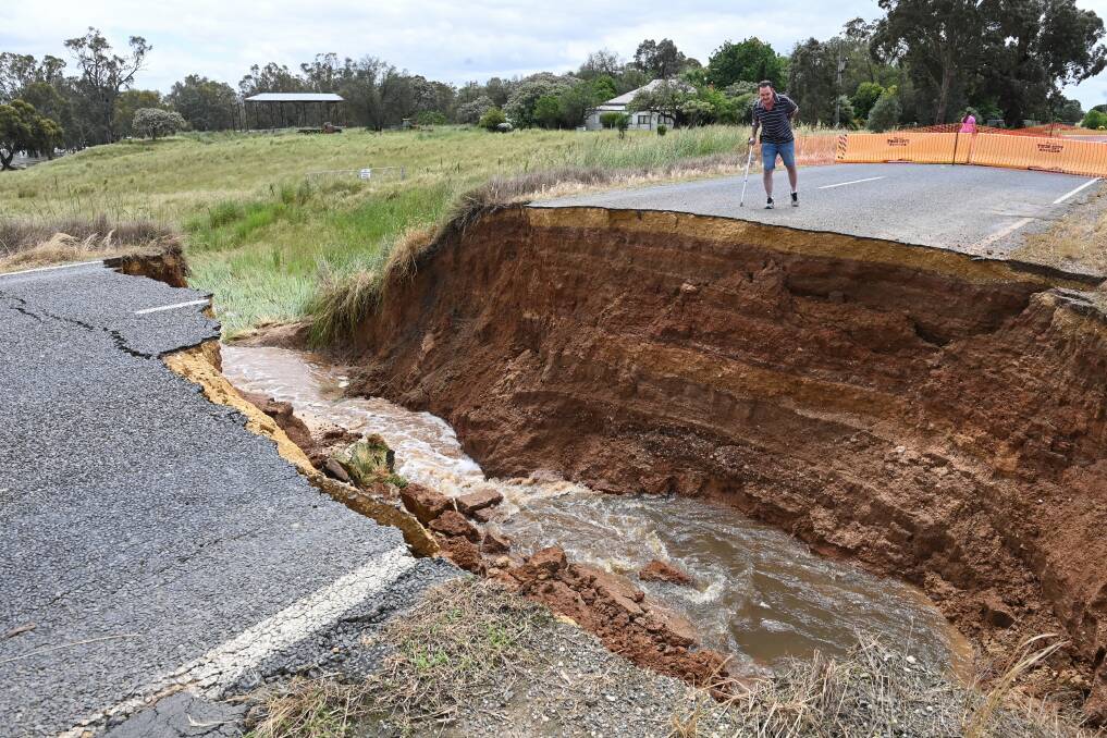 The six-metre deep hole had residents shocked at how quickly the gap at Gooramadda Road has widened in a short amount of time due to flooding. Picture by Mark Jesser