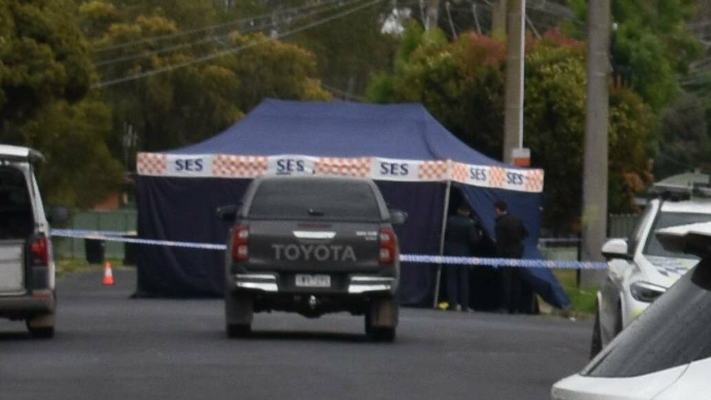 Forensic investigators at the scene where the injured man was found. Picture by Benalla Ensign