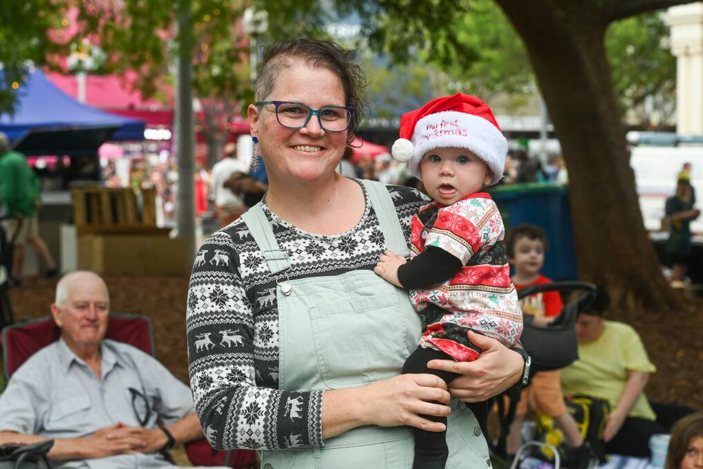 Beechworth wasn't far to travel for Catherine Bijker and Ophelia Bijker, 9 months, to enjoy Carols by Candlelight at Albury's QEII Square on Wednesday, December 20. Picture by Mark Jesser