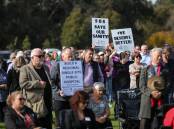 SIGNS OF THE TIMES: Hundreds turned up at Gateway Lakes to show their support. Picture: JAMES WILTSHIRE
