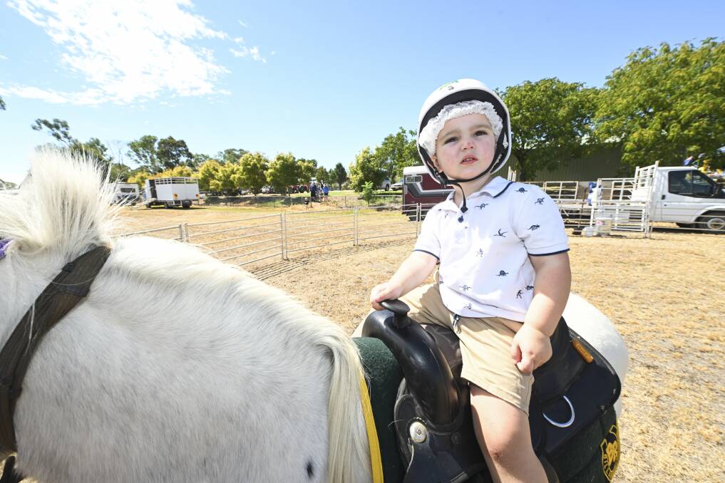 Isaac Hales, 2, from Bandiana finds himself back in the saddle after discovering the joys of riding horses at the Mighty Mitta Muster last weekend. Picture by Mark Jesser