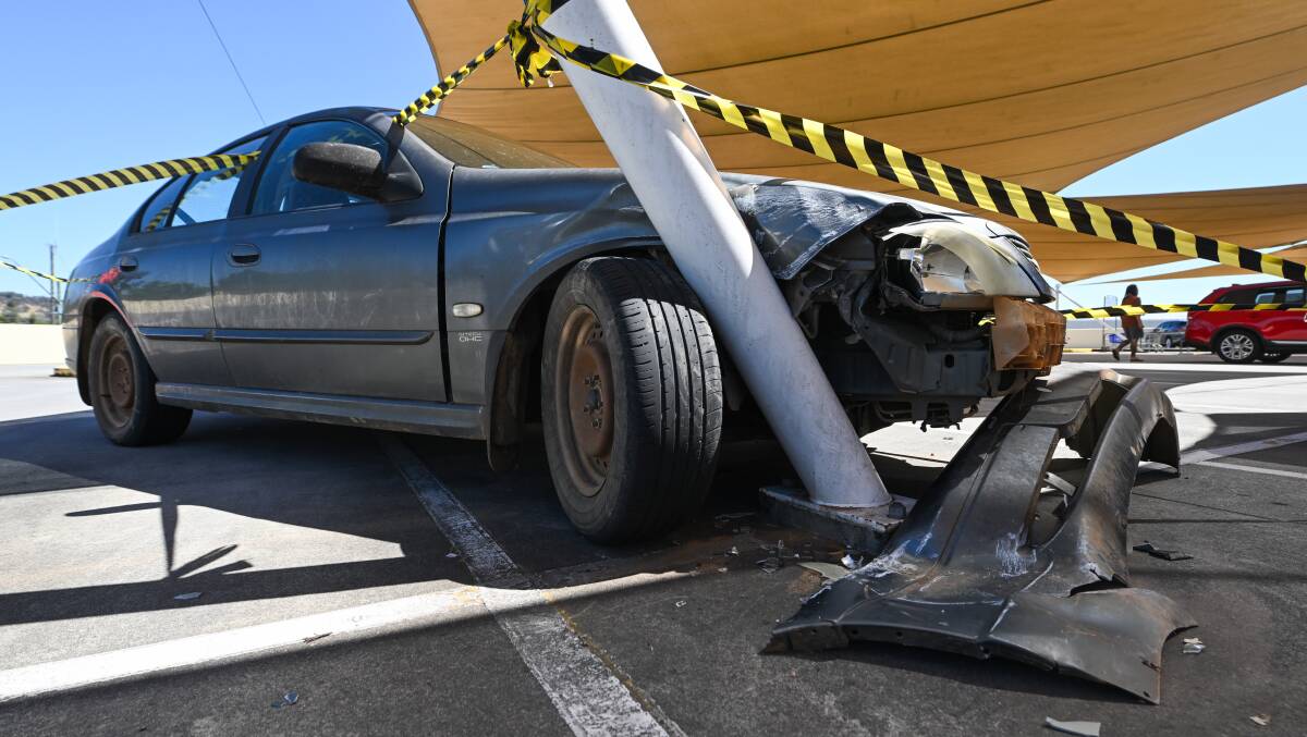A Ford Falcon was found smashed into this pole at the Lavington Square car park. Picture supplied