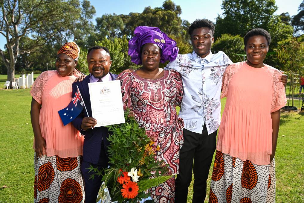 New citizen Pastor Kalwindi Mbele with his wife Honorina Naomba, and children Ungwa Byussa, left, and Prince Kiza and Eto Naabwe, right. Pastor Mbele said he's been to other Australian cities but they don't stack up against Wodonga. Picture by Mark Jesser