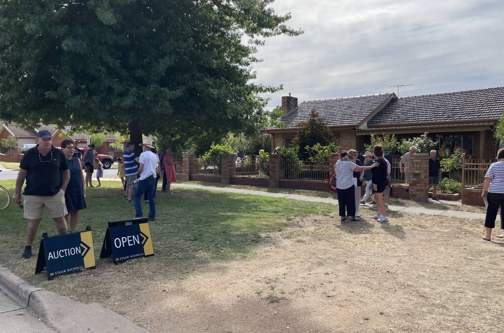 About 60 people gathered for the auction at Thurgoona Street on Saturday, but just two bidders jousted for the prize. Picture by Ted Howes