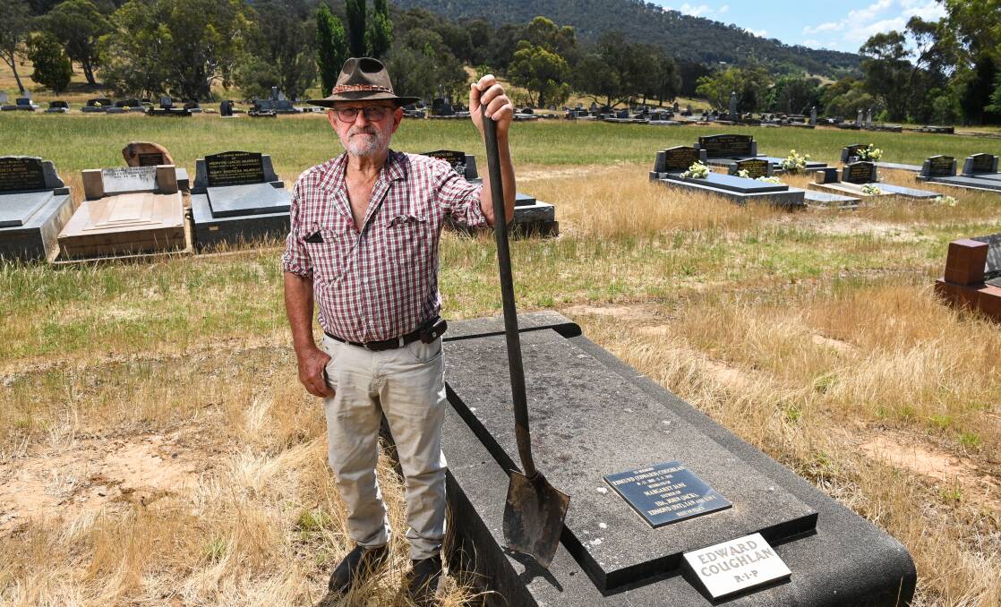 Former gravedigger Adrian "Ace" Coughlan, pictured in front of his grandfather's grave at the Walwa Cemetery, is a life member of the trust. Picture by Mark Jesser