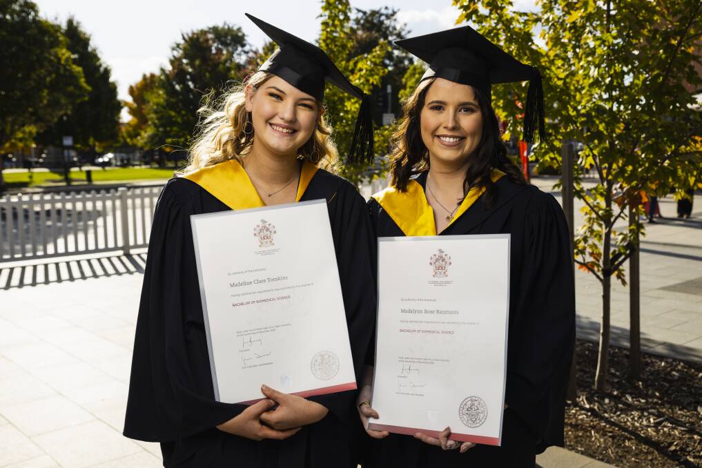Soulmates Madeline Tomkins and Madalynn Baumanis were among the 136 La Trobe University's Albury-Wodonga campus students to celebrate their graduation at The Cube, Wodonga, on Thursday afternoon. Picture by Ash Smith
