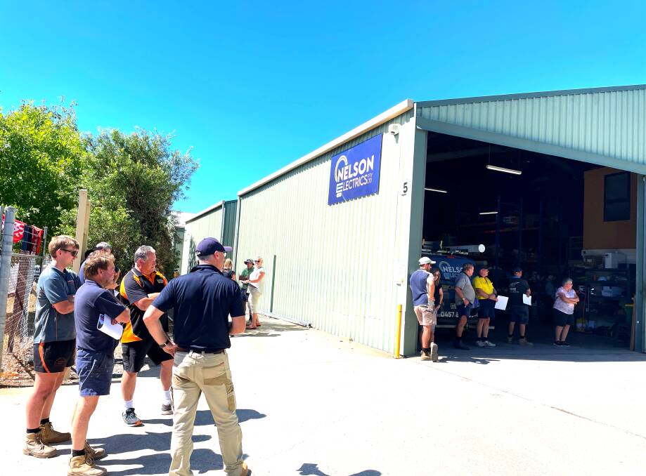 A crowd of about 30 crowded around the Nelson Electrics warehouse on Carcoola Street, North Albury on Friday, March 15. Picture by Ted Howes 