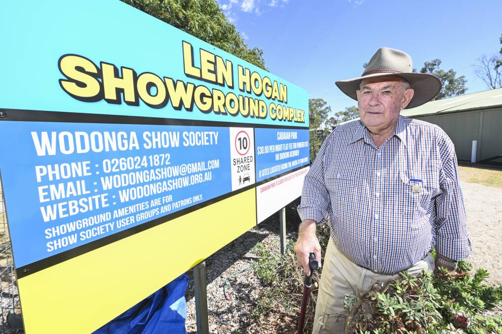 Former Wodonga Show Society president Len Hogan was taken by surprise when a sign naming the ground after him was unveiled on Saturday morning. Picture by Mark Jesser
