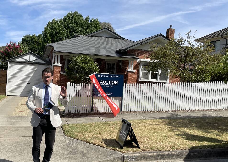 Lachlan Hutchins, of Stean Nicholls, in front of the property at 725 Jones Street that was passed in for $1.2 million. Picture by Ted Howes