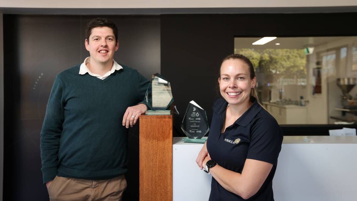 Formulae pharmacist in charge Andrew Middlin and general manager and formulation chemist Jo Wilkie show off their Albury Wodonga Business Awards trophies. Picture by James Wiltshire