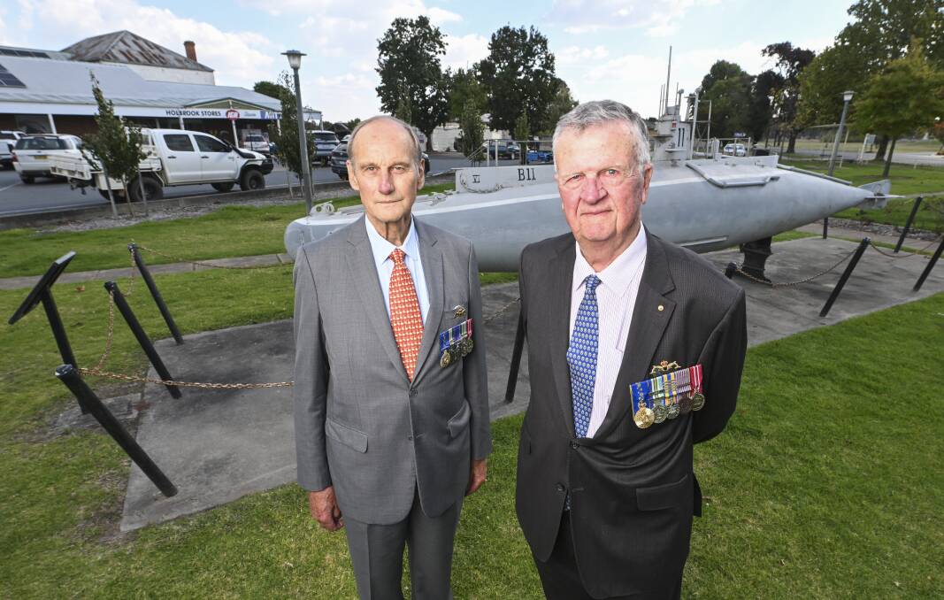 Ex-submariner veterans Michael White and Terry Roach visit the Commander Holbrook Memorial Park on Thursday, 24 hours before their meeting with the owners of the supermarket across the road. Picture by Mark Jesser