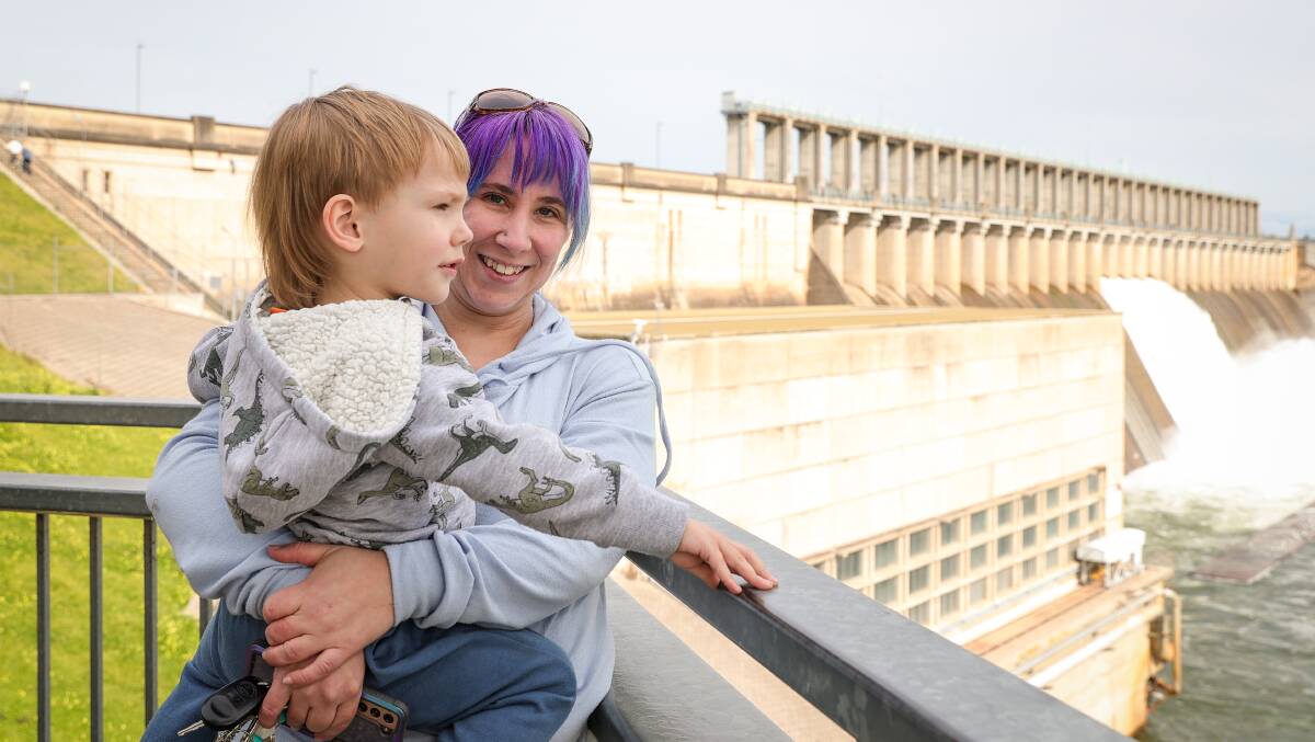 Thurgoona mum Tara Hancock with Aiden Harvey, 3, look on as four gates open on the Hume Dam wall last week. Picture: JAMES WILTSHIRE