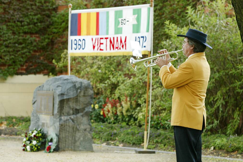 The banner in the centre of the controversy, pictured next to Toli Kolisnyk at the Albury Anzac day ceremony in 2006. File picture