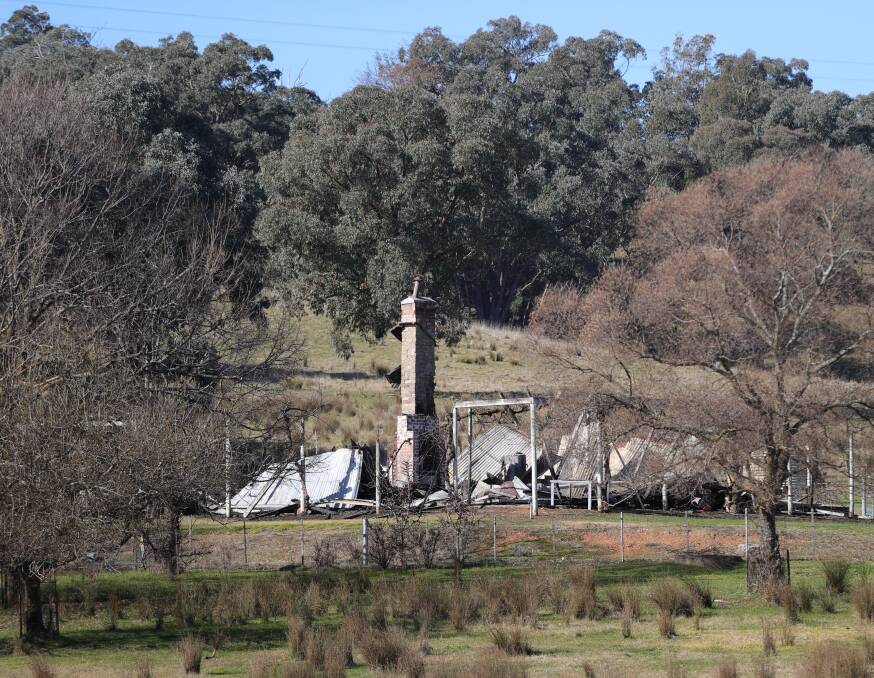 DEVASTATION: A chimney stands amid the rubble - all that is left of the Woomargama home of Nick Finlayson and his partner Jess Dodson. Picture: JAMES WILTSHIRE