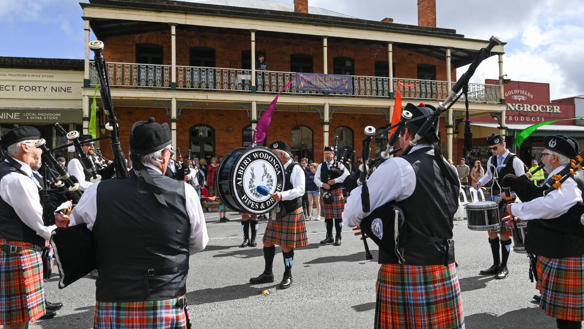 The Albury-Wodonga Pipes and Drums entertain the crowds on Ford Street. Picture by Mark Jesser