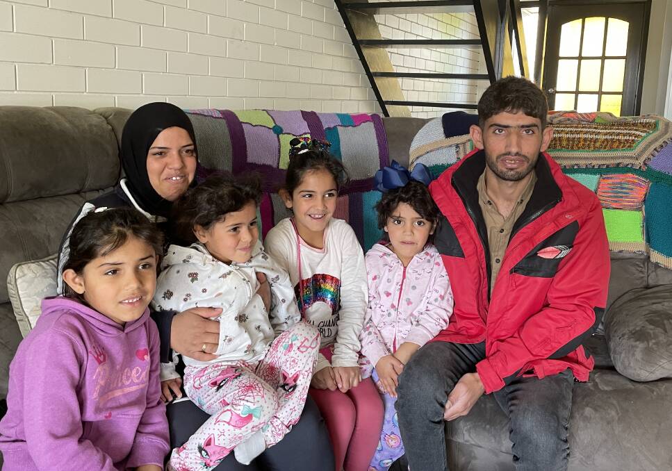 From left, Syrian family Fatemah, Khaldieh Al Damous, Khetam, Rim, Malak and Farham Alayed settle into their new home in Lavington, after receiving help to relocate from Lebanon. Picture by Ted Howes