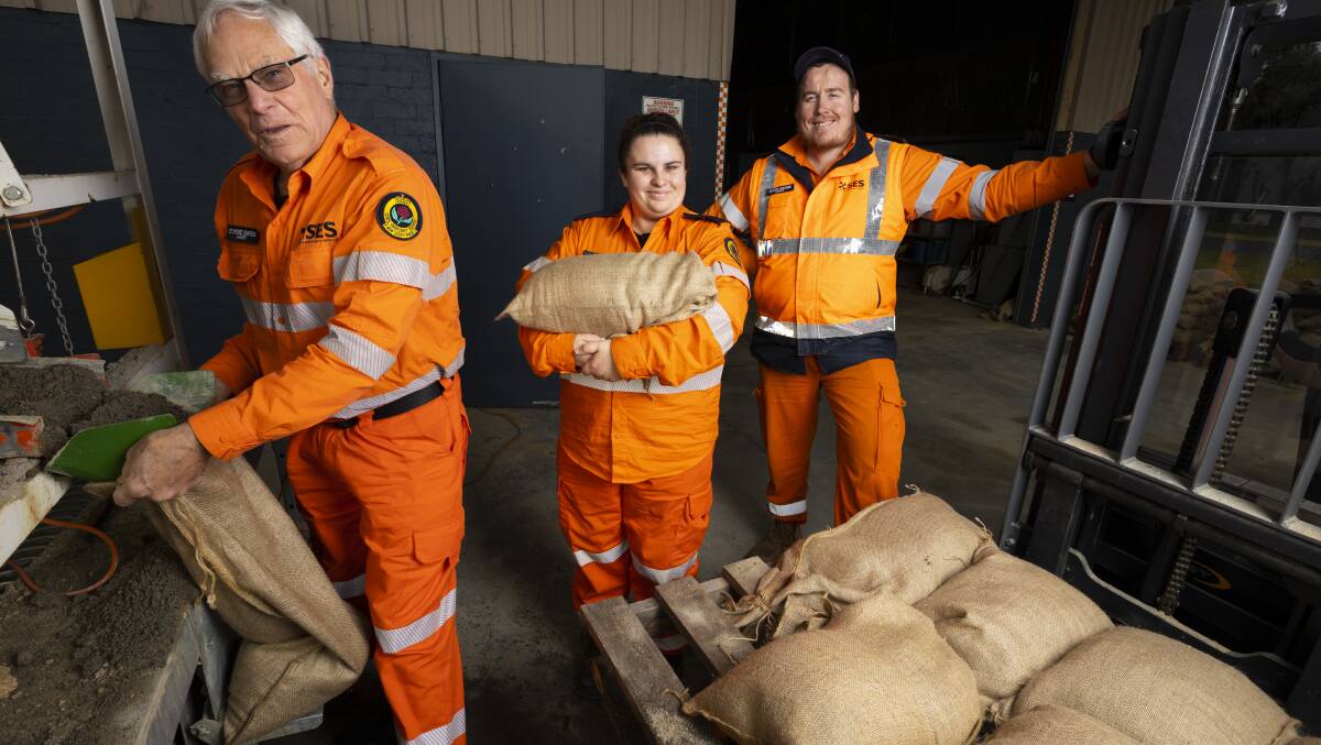 DEMAND: SES members Stafford Simpson, Chloe O'Leary and Albury unit commander Curtis Kishere stock up on sandbags ahead of upcoming storms. Picture: ASH SMITH