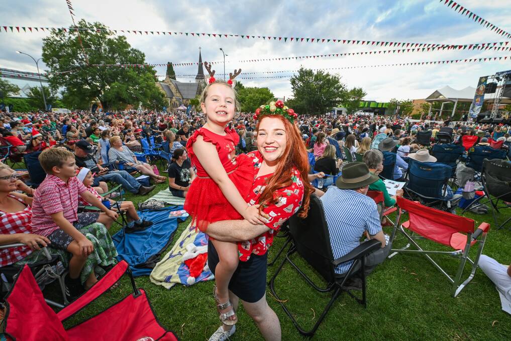 Ebony Hollis, 6, of Albury, and her auntie, Nicola Habgood, who travelled from the Sunshine Coast to enjoy Carols by Candlelight with her family at QEII Square on Wednesday, December 20. Picture by Mark Jesser