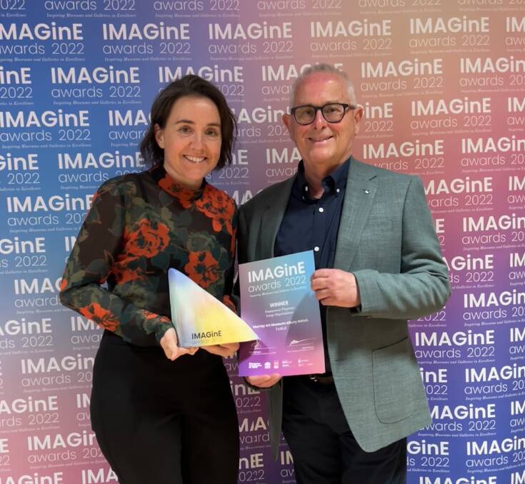 MAMA engagement officer Annie Falcke accepts the IMAGinE Engagement Programs award from Museums and Galleries of NSW chair Ray Christison. Picture supplied.