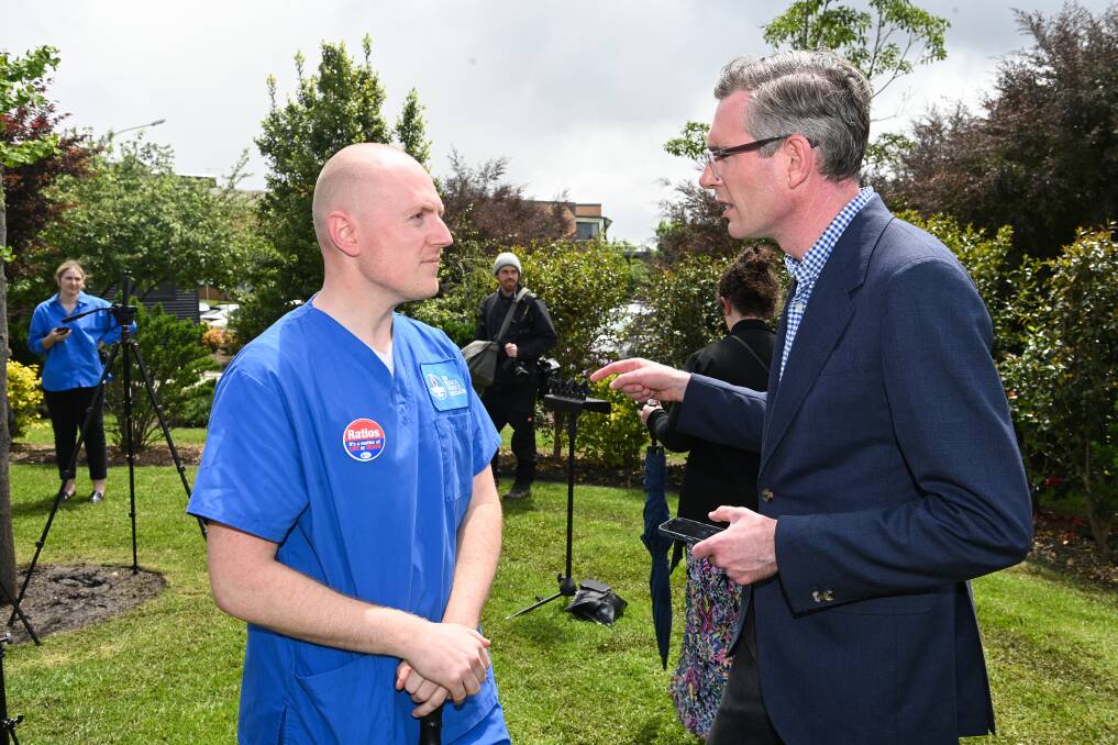 Nurses and Midwives Association branch member Geoff Hudson, pictured here with NSW Premier Dominic Perrottet at Albury Base Hospital, said health was a major issue in upcoming Victorian and NSW state elections. Picture by Mark Jesser.