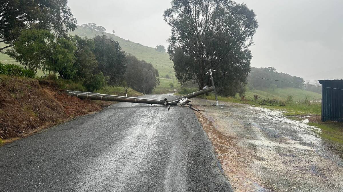 Tallangatta's Yabba Road closed in both directions as local fire brigade attends to fallen power pole. Pictures by James Paton.