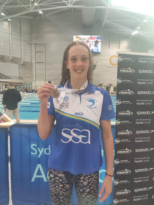 Isabelle Rae with her silver medal in a personal best breaking 200m breaststroke effort at the NSW Senior State Age Championships earlier this month