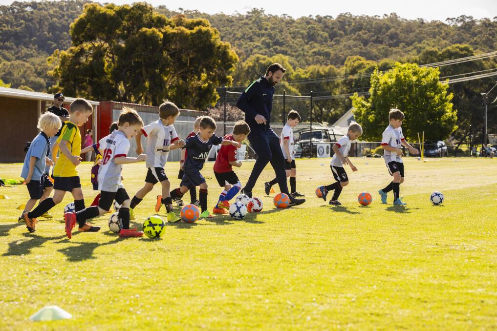 Socceroos icon and former Twin City and Boomers product Josh Kennedy returned to Glen Park on Thursday evening to take kids through their paces. Picture by Ash Smith