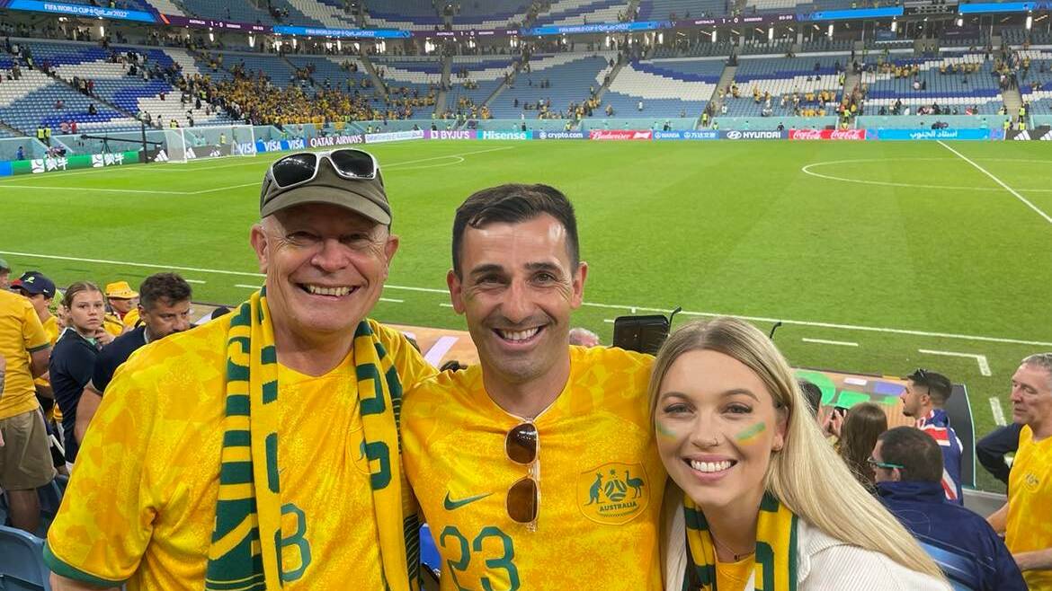 Border local David Afonso (centre) at the World Cup alongside Craig Goodwin's father Tony and partner Katelyn. Picture supplied