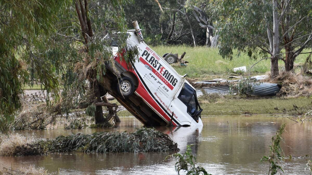 
One of the many vehicles swept away during a flash flood in the town of Eugowra, Central West New South Wales, Tuesday, November 15, 2022. (AAP Image/Murray McCloskey)