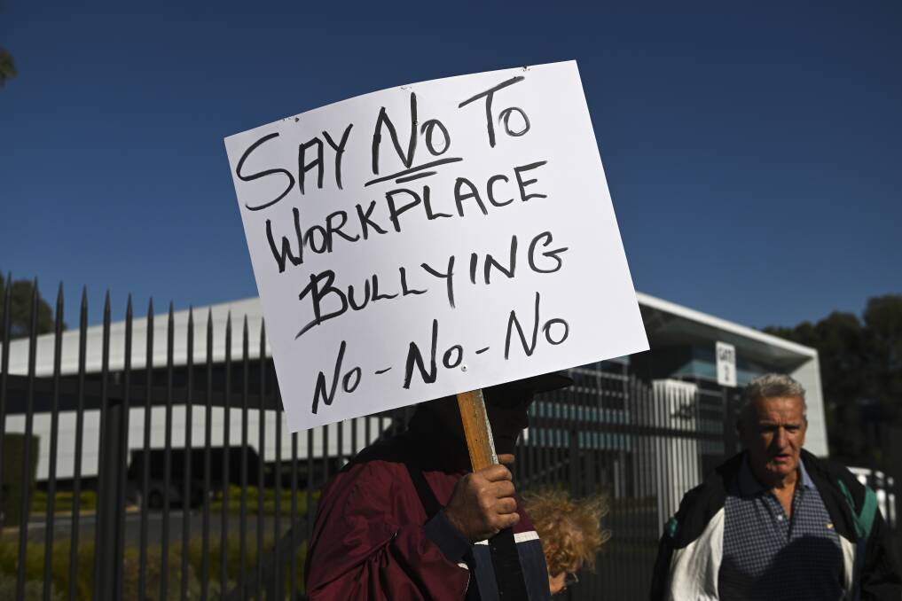 Protesters were holding signs outside Joss headquarters, condemning workplace bullying. Picture by Mark Jesser