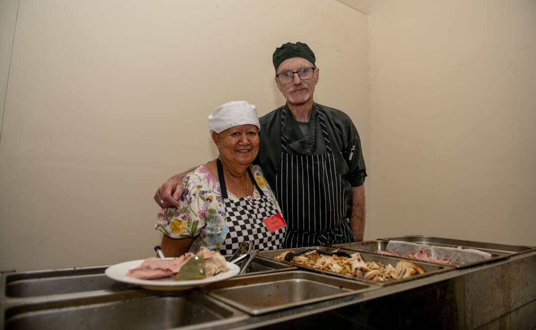 Volunteer Jeanette Findlay and chef Jim Hart busy serving food. Picture by Tara Trewhella