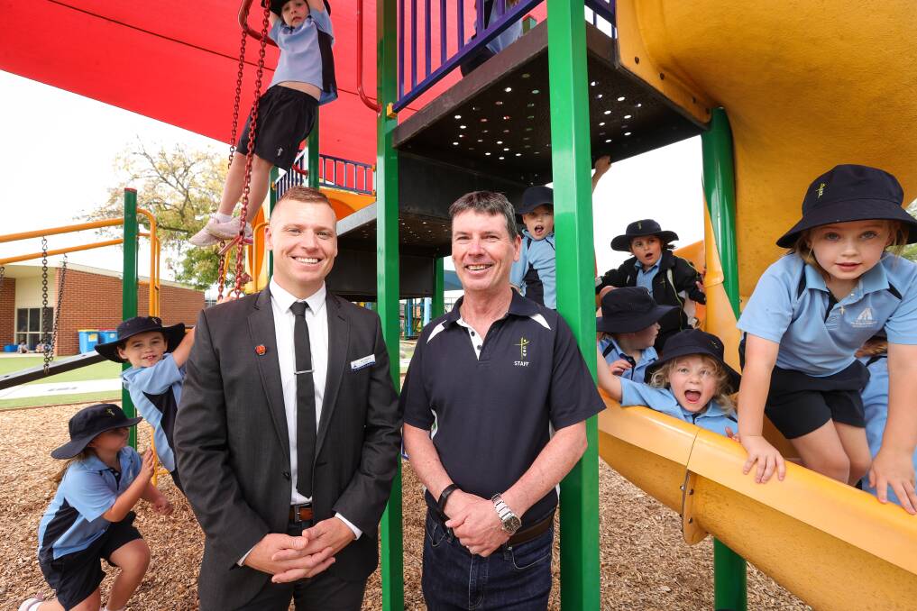 St Augustine's school has a new principal, Zac Fulford, who here stands alongside his old teacher Paul Jackson. Picture by James Wiltshire