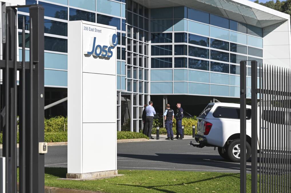 Police talking to Joss Group employees at the companies headquarters in East Albury. Picture by Mark Jesser
