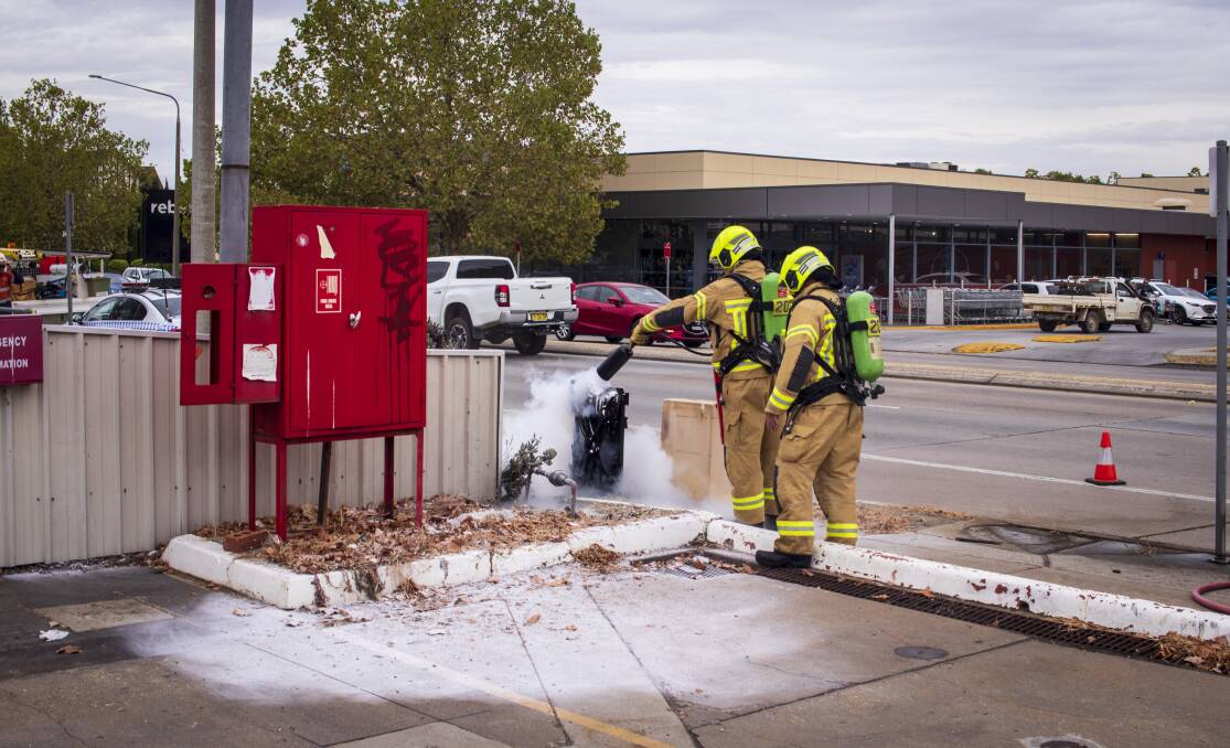 Fire crews extinguish the junction box fire at the Mobil service station on the corner of Guinea and Young Street, Albury. Picture by Layton Holley