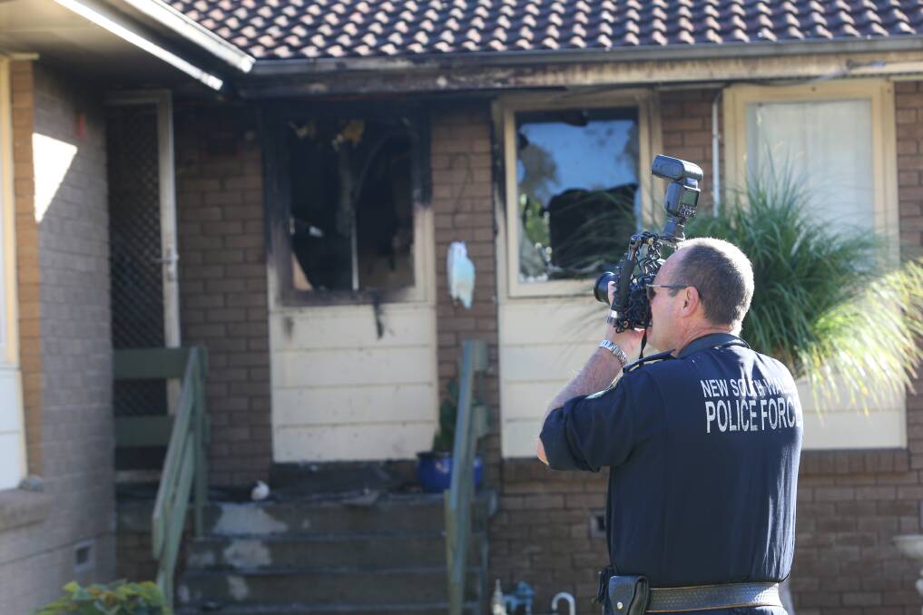 Forensic investigators examined the burnt out home on Ryan Road in North Albury after Thursday morning's fire. Picture by Blair Thomson